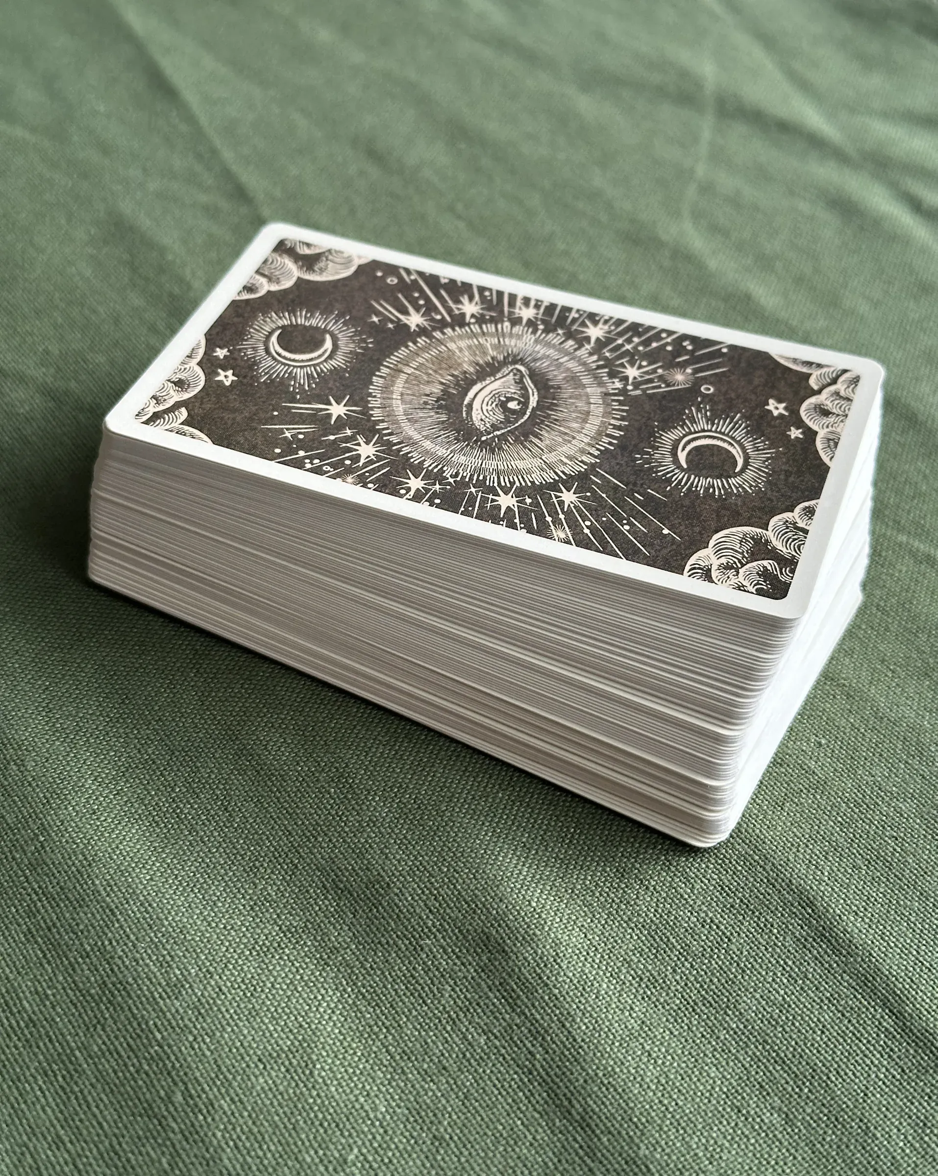 The deck stacked on olive linen