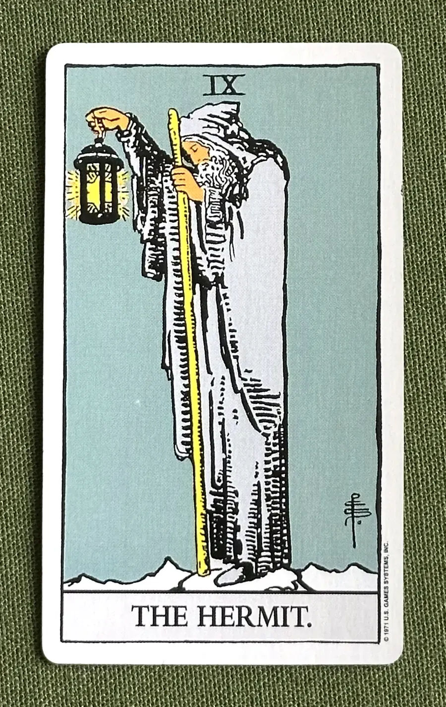 The Blue Buddha — The Hermit from the Rider–Waite deck