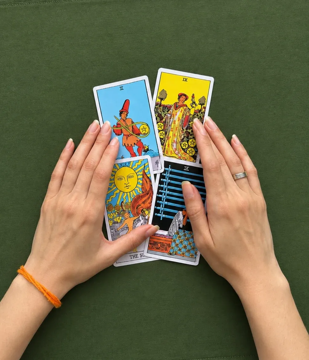 Tahmina’s hands over a spread on olive linen