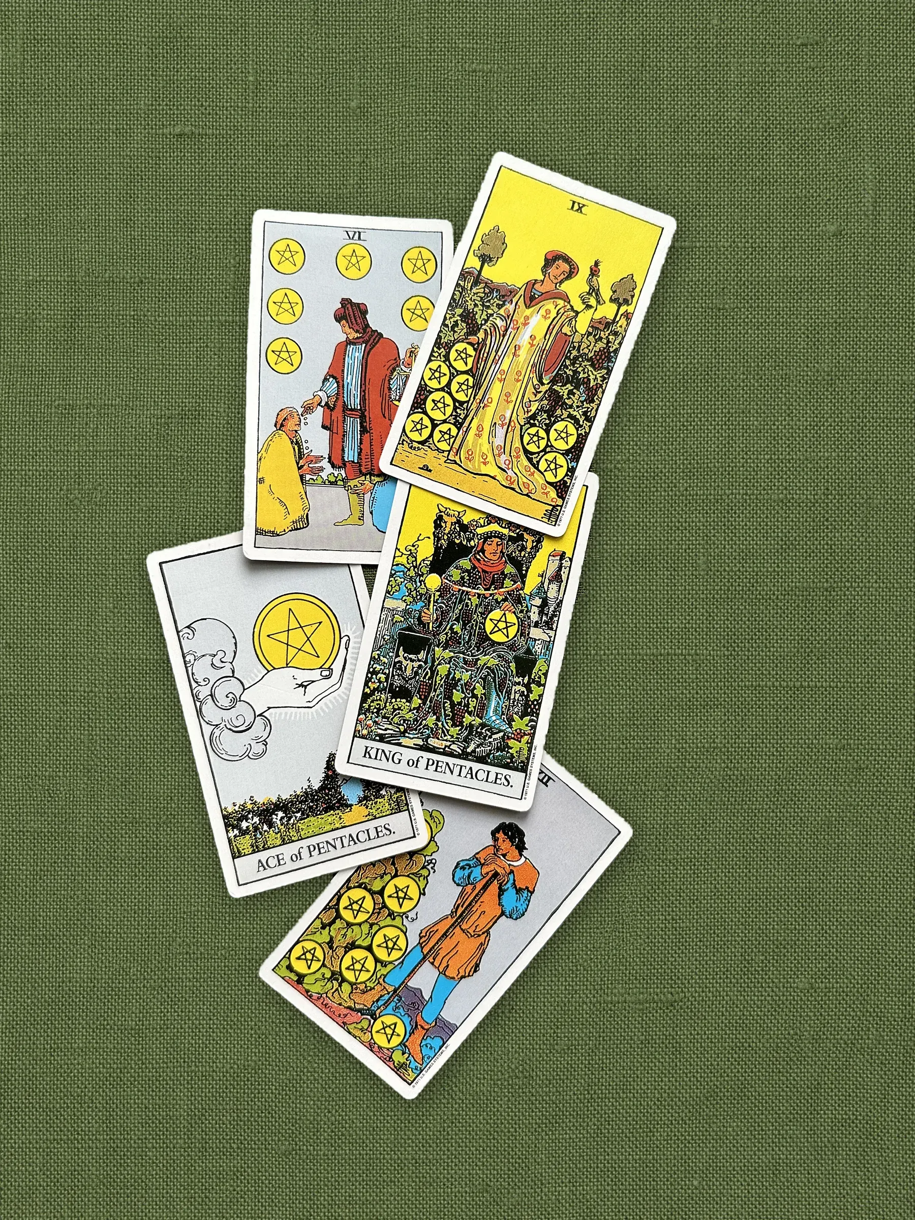 The suit of Pentacles on olive linen