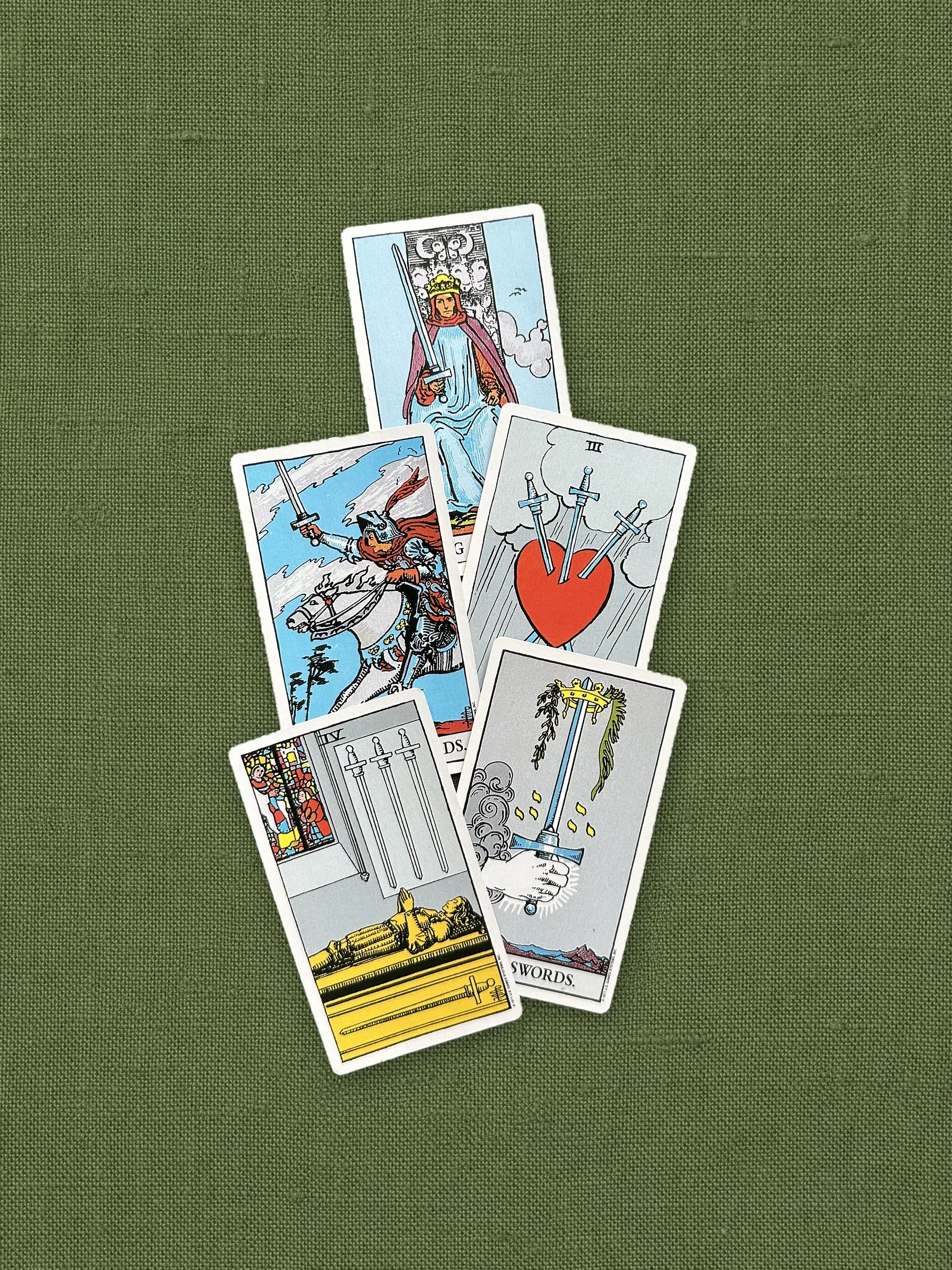 The suit of Swords on olive linen