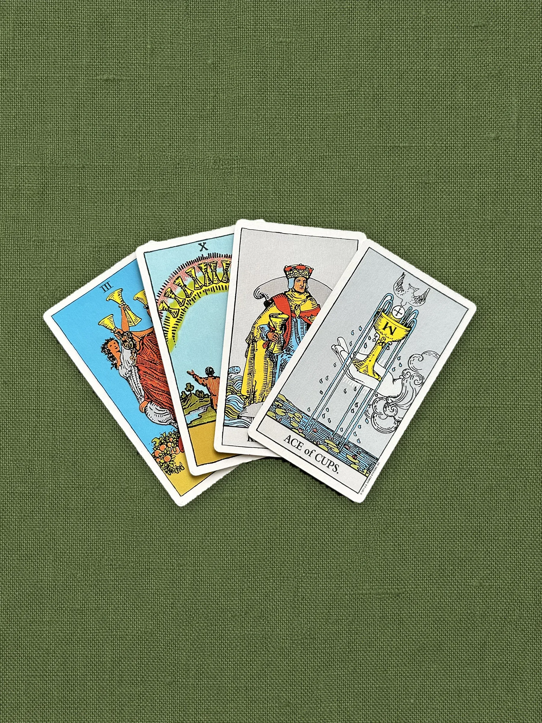 The suit of Cups on olive linen