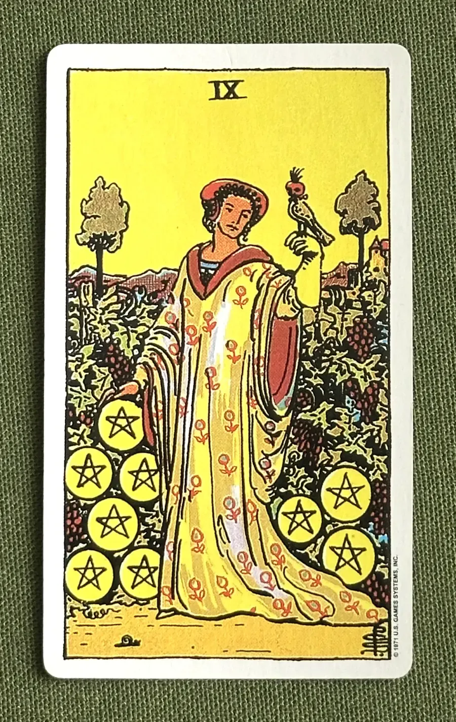 Nine of Oaks — Nine of Pentacles from the Rider–Waite deck
