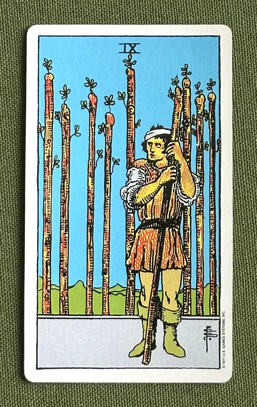 Nine of Arrows — Nine of Wands from the Rider–Waite deck