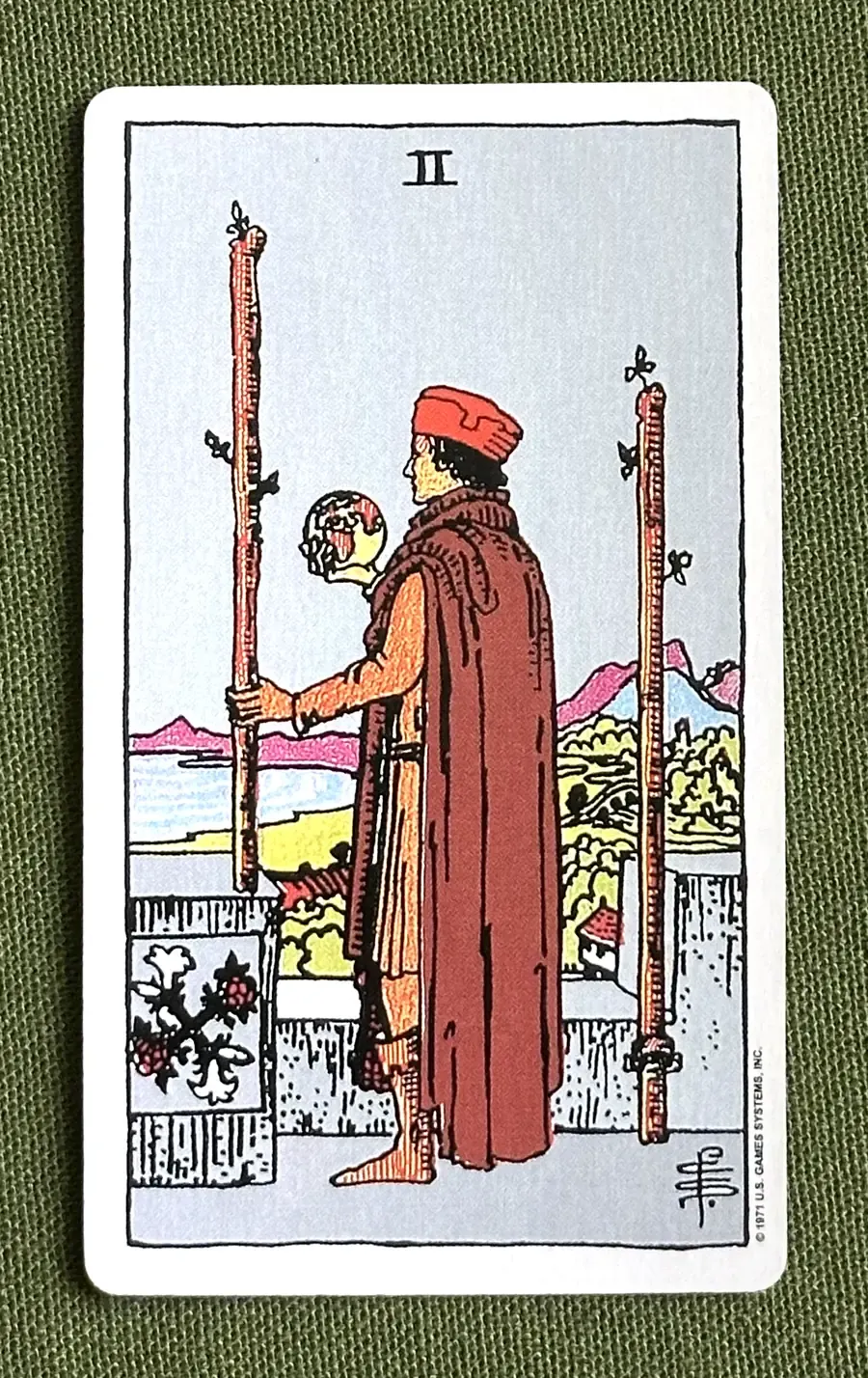 Two of Arrows — Two of Wands from the Rider–Waite deck